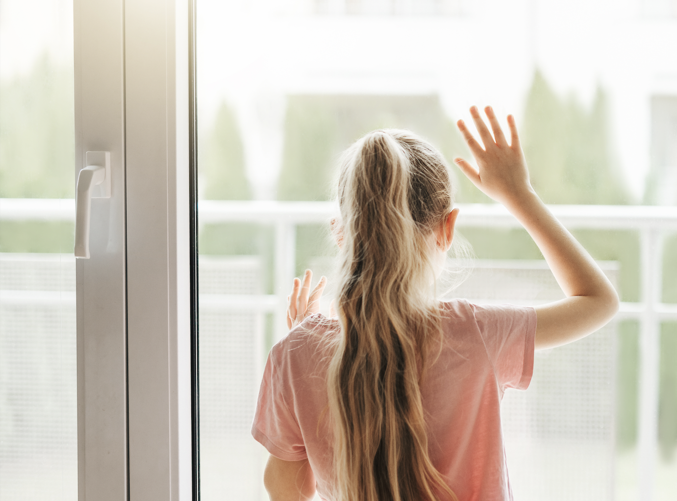 Girl looking outside a window. Girl looking outside a window.
